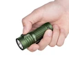 Hand holding green Olight Baton 3 flashlight, pressing the side switch.