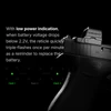 Black Olight Osight K optic mounted on pistol showing low power battery indicator flashing green reticle for tactical use