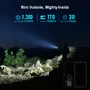 Olight Baton 4 Premium Edition flashlight illuminating a mountain path at night for hiking and outdoor adventure.