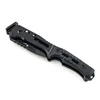 Black tactical folding knife with textured G10 handle on white background