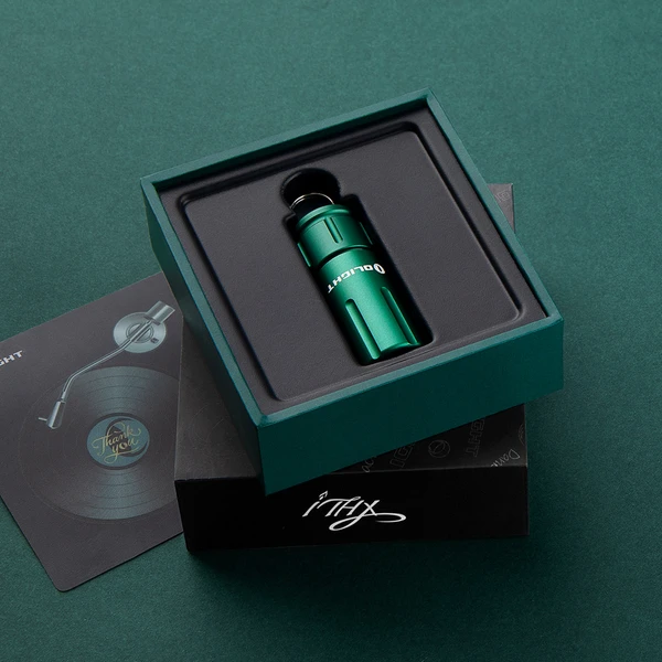 Green Olight iTHX EDC flashlight in premium gift box with thank you card.