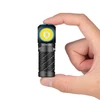 Olight black Perun 3 Mini headlamp held by hand, showcasing compact size for everyday carry