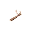 Rose gold metal clip with circular holder attachment isolated on white background