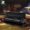 HX Outdoors folding pocket knife in protective foam-padded hard case at campsite