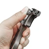 Hand adjusting a metal quick-release clamp on a camera mount extension arm