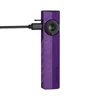 Purple Olight Arkfeld Pro flat flashlight charging with a USB-C cable showing green battery indicator lights