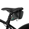 Compact gray cycling saddle bag attached to a bicycle seat.