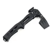 Black tactical folding pocket axe with textured handle on white background