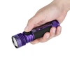 Olight Purple Seeker 4 Pro Flashlight Held in Hand with Textured Grip for Everyday Carry