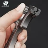 HX Outdoors metal slingshot held in hand closeup showing quick release mechanism and sturdy build