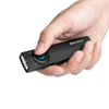 Olight Black ArkPro Lite Flashlight Held in Hand with Blue Button for Everyday Carry and Illumination