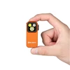 Olight Orange OCLIP PRO compact multi-light flashlight held in hand for everyday carry.