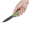 Hand holding green and red blood splatter patterned folding knife