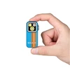 Olight Blue OCLIP PRO multi-function EDC light with orange stripes, held in hand.