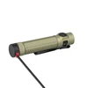 Olight OD Green Baton Ultra flashlight being charged with magnetic cable, showcasing its durable textured grip and convenient pocket clip.