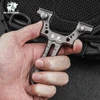 HX Outdoors heavy-duty titanium alloy slingshot held in hand for outdoor hunting and target shooting