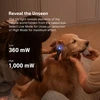 Olight ArkPro Ultra UV flashlight detecting unseen elements on a dog's ear for pet care.