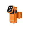 Olight orange clip-on flashlight with adjustable tilting LED light head and rotary control switch isolated on white background