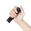 Hand holding compact flat black EDC tactical flashlight showing pocket-sized design against white background