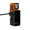 Olight orange clip light charging on a black power bank with a digital battery indicator showing 50 percent capacity