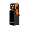 Olight Oclip 2 UV orange clip-on EDC flashlight in its black charging dock isolated on a white background