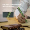Olight Green Open 3 penlight held by a hand writing on paper, showcasing its textured grip for comfortable writing.
