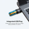 Olight Blue and Orange Imini 2 Keychain Flashlight plugged into a laptop for convenient USB charging