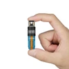 Olight Imini 2 in Blue and Orange held between fingers, featuring a magnetic base and compact design for daily carry.