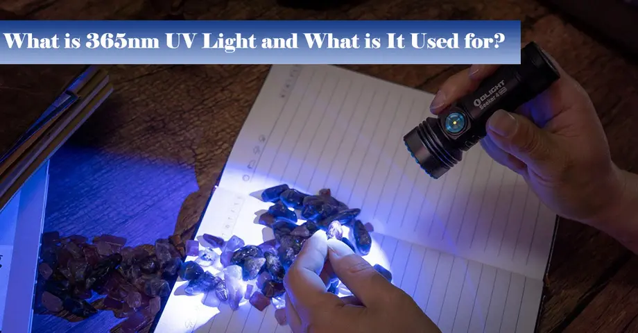 Person using a UV flashlight to examine rocks on a notebook, highlighting their fluorescence.