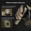 Gloved hand holding Olight tactical flashlight highlighting textured metal tail switch and hexagonal side button details.