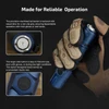 Gloved hand holding a blue tactical flashlight showing its non-slip tail button and hexagonal side button design.