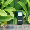 Olight Black Arkfeld Pro and Oclip Pro with Blue Bezel on a Rusty Ledge with Green Leaves for Outdoor Lighting